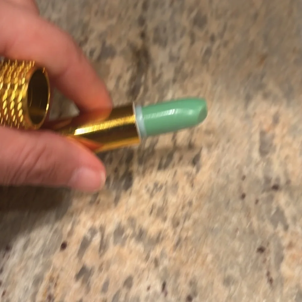 NWOT Color change lipstick. Never been used but has a dent on the tip